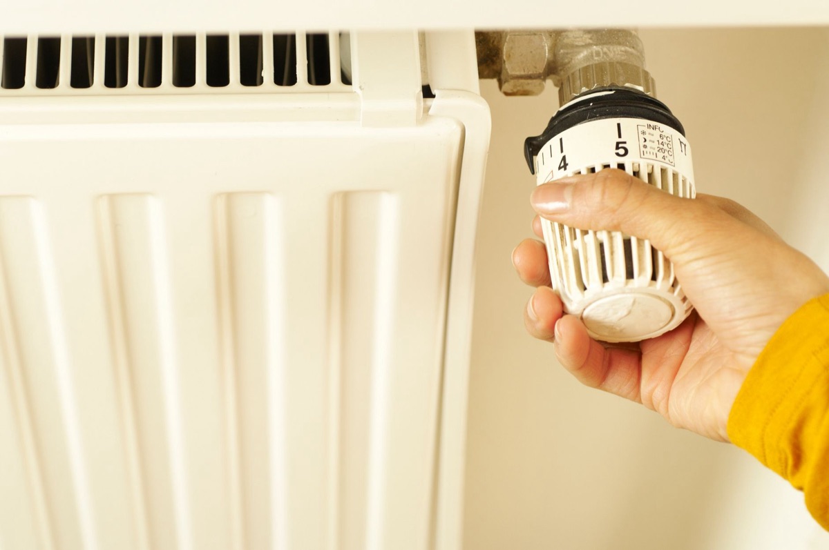 smart thermostat device in modern home