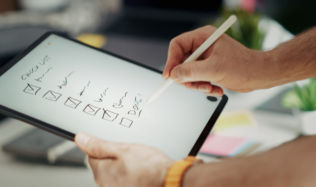 Glossy notebook with checkmark for budget tracking